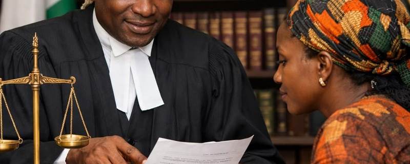 A lawyer reviewing legal documents with a survivor during a consultation